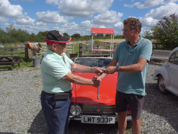 MG keys being handed over to new owner
